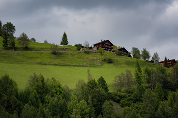 Rural Alpine landscape with houses and cottages in Hohe Tauern National Park, Austria, Europe. Summer time.