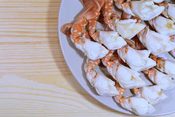 Top View of Delectable Steamed Flower Crab Legs Served on Wooden Table 