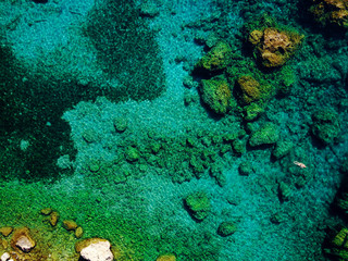 Top view of amazing nature background while man relaxing in the water.