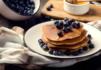 Pancakes with fresh blueberry and honey