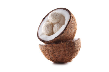 Coconuts with candies isolated on a white background