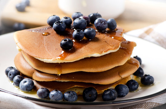 Pancakes with fresh blueberry and honey