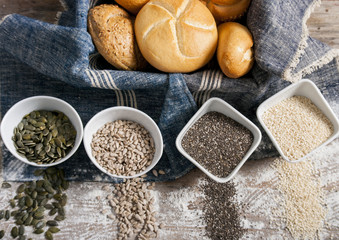fresh rolls and freshly baked bread with variety of healthy seeds