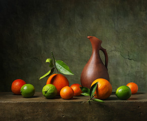 Still life with citrus fruit and jug © Marta Teron