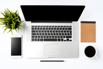 Office desktop with modern laptop and accessories. Business background