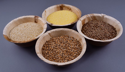 Four sorts of cereals in bowls.