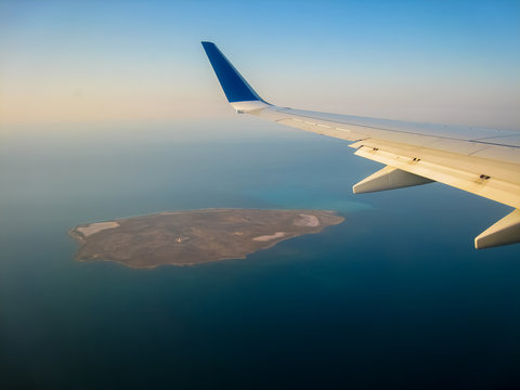 Uninhabited sandy island in the Persian Gulf off the coast of Dubai UAE from the height of the flight