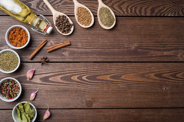 Fresh herbs and spices on wooden table. Close up