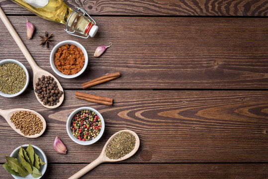 Fresh herbs and spices on wooden table. Close up