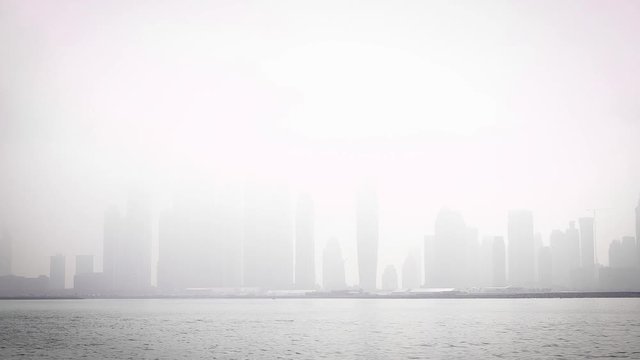Skyscrapers surrounded by fog