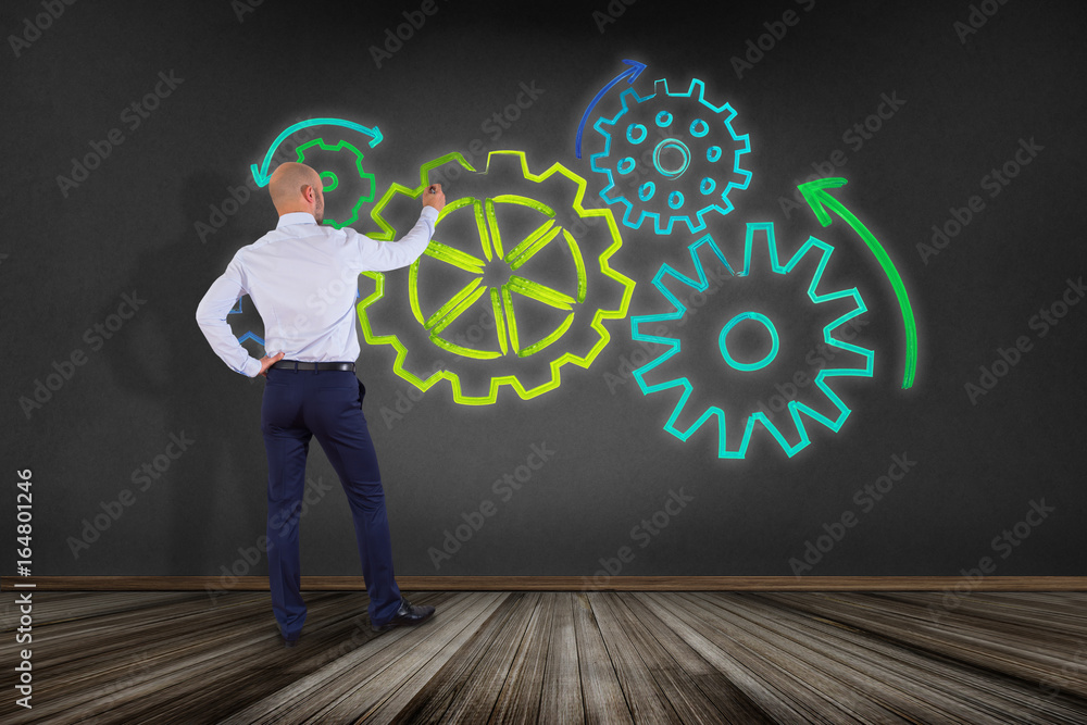 Poster businessman in front of a wall with a cogwheel interface setting with different colors - technology 