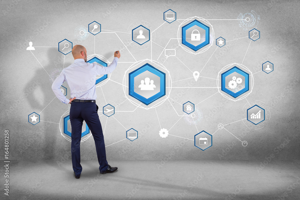 Aufkleber businessman in front of a wall with an international business network connection displayed on a futu