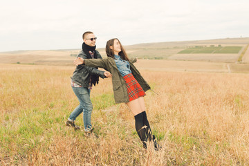 Young modern stylish couple outdoors