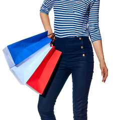 Closeup on modern woman with shopping bags on white