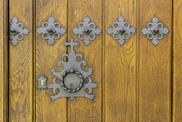 Old medieval wooden door with lock