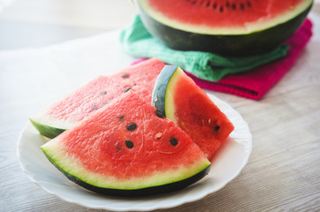Delicious fresh sliced watermelon on white wooden table