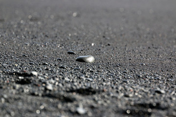 Fototapeta na wymiar Pebbles on the black beach in Vik, Iceland 