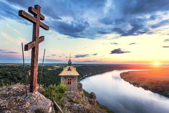 Cross On A Top Of A Mountain Above River Canyon