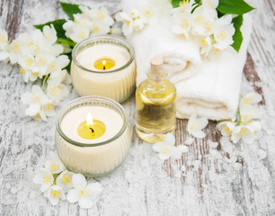 Massage oil and jasmine flowers