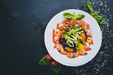 Seafood salad, mussels, shrimp, squid, and fresh vegetables. Free space for your text. Top view.