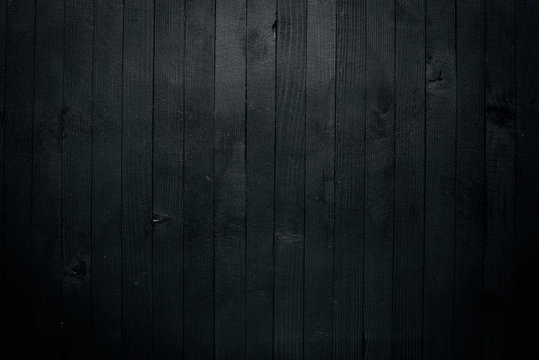 Black wooden surface. Free space for your text. Top view.