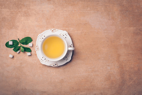 cup of green tea with mint leaves;