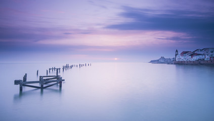 Sunrise over old pier
