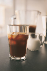 Glass of cold brew coffee on dark table