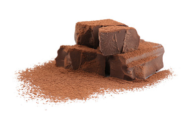 Pile of dark chocolate chunks and cocoa powder on white background