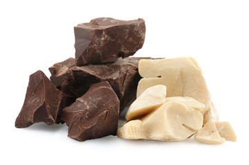 Dark chocolate and cocoa butter pieces on white background