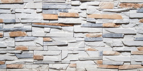 white and red brick decorative wall with shadows on texture. background, texture, decoration.