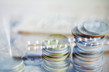 Double exposure Rows of coins of Credit cards on the table,finance and business concept,Money,soft focus and blurred style,dark tone.