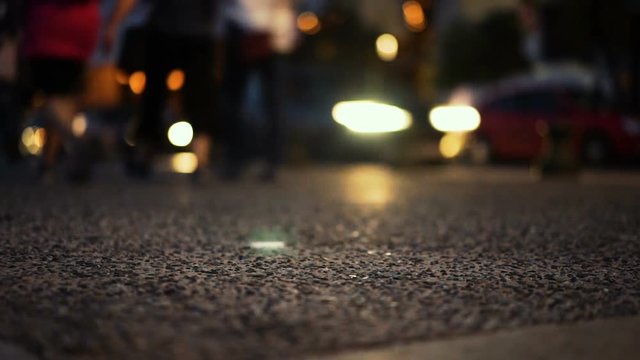 People Walking at night and car traffic and lights,   intentionally defocus to create Natural Blur effect