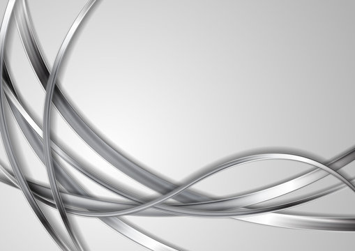 Metallic silver abstract waves on grey background