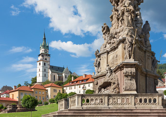 Fototapeta na wymiar Kremnica - The Safarikovo square and detail of the baroque Holy Trinity column by Dionyz Ignac Stanetti (1765 - 1772), castle and St. Catherine church.