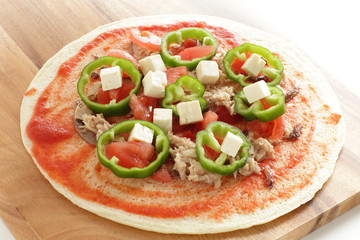 prepared pizza ready for baking