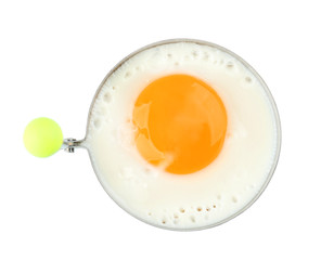 Fried sunny side up egg in round mold on white background