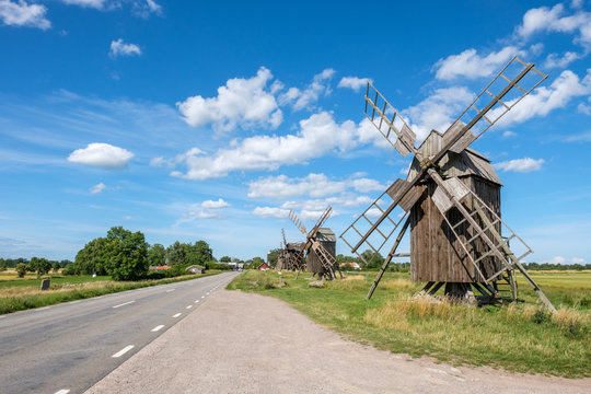 Row of traditional windmills at Lerkaka on Swedish island Oland in the Baltic Sea. Windmills are a common sight on Oland, which is nicknamed “the island of the sun and winds”.
