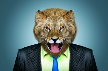 Fototapeta premium Portrait of a lion in a business suit on a blue background
