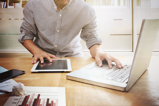 Men's hands touch the tablet screen.mobile payments online shopping customer network connection on screen. m-banking and omni channel concept