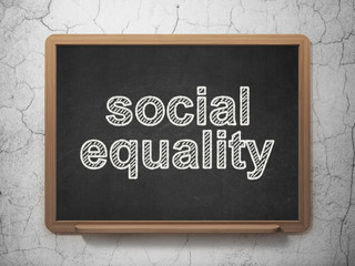 Politics concept: Social Equality on chalkboard background