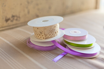 Rolls with pastel color ribbons and lace