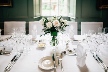 Vase of roses on dining table