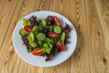 Fresh salad with mixed greens, cherry tomato and cucumber