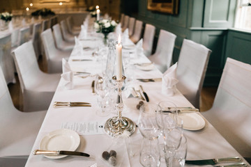 Fine dining table, silverware and candles