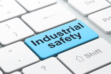 Constructing concept: Industrial Safety on computer keyboard background