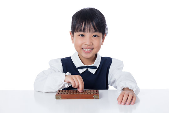 Asian Chinese little girl playing abacus