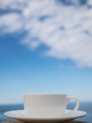 Coffee espresso on wood table nature background on the beach, Beauty nature background