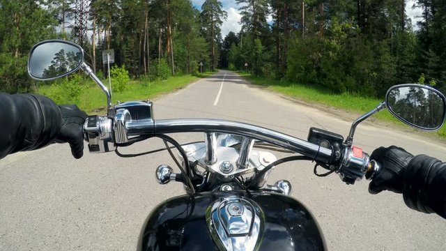 High speed motorcycle ride, handlebar close up.