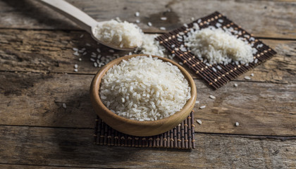 rice, jasmine rice, mali rice in Ladle and basket on the wood background